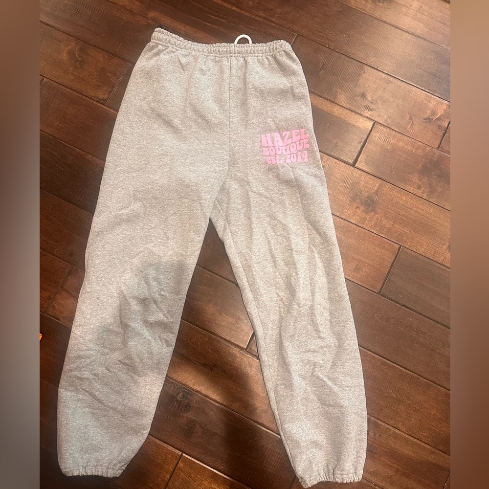 Grey cuffed sweatpants from local boutique with pink writing